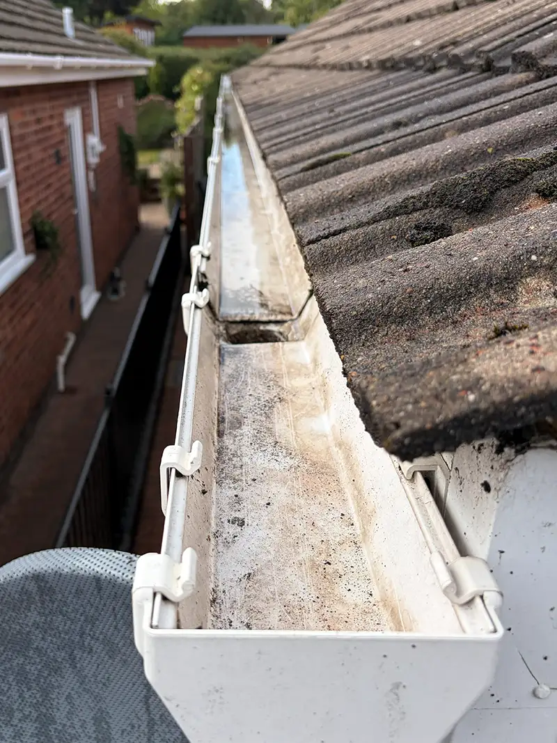 Clean clear guttering after high-reach vacuum removal